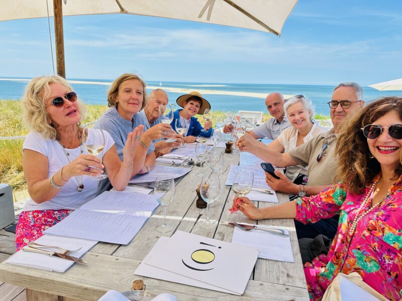 Bordeaux tour guests at lunch with a beautiful view of the Arcachon basin