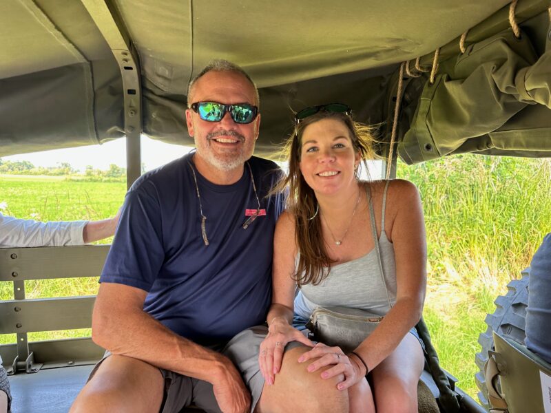 Jack and Cami riding in Flo's WWII jeep during France Off the Beaten Path Normandy Tour.